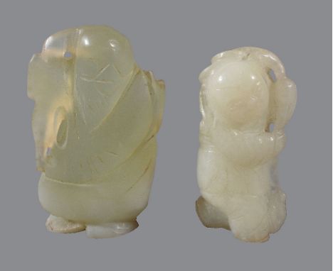A Chinese white jade carving of a boy, standing holding a branch, with mutton fat inclusions, 5cm high and a Chinese celadon 