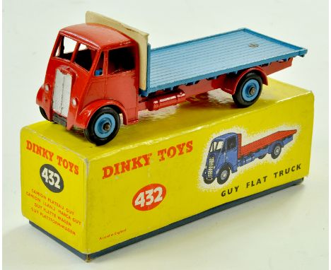 Dinky No. 432 Guy (2nd Type) Flat Truck. Issue has red cab, chassis, light blue back and Supertoy hubs with smooth tyres and 