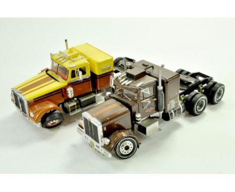 Duo of kit built American Trucks in 1/24 scale. Some damage so for repair only.  &nbsp;Note: We are always happy to provide a