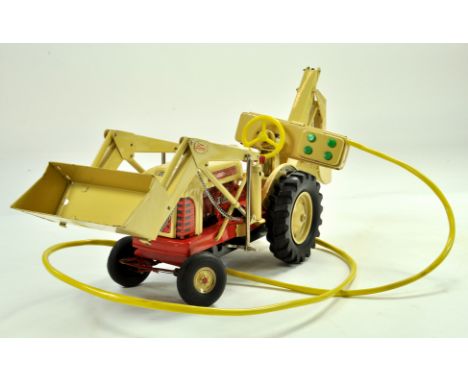 Cragstan (Japan) Ford 4040 Industrial Tractor. Battery operated large scale tinplate tractor with front loading shovel and Ba