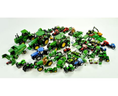 A substantial collection of smaller scale tractor models, mostly John Deere, but some others, in addition to some 1/32 exampl