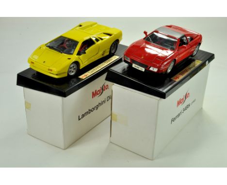 Duo of 1/18 Maisto diecast cars, Lamborghini and Ferrari. Appear very good, lamborghini needs mirror reattaching with boxes. 