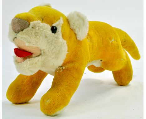 An interesting charging Lion with red tongue. 44cm nose to tail. Very Good. Note: We are always happy to provide additional i