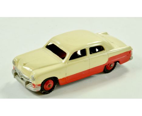Dinky No. 170 Ford Fordor Sedan Low-line. Issue is two-tone pale cream and red including red ridged hubs. Appears very good t