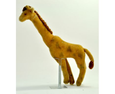 An unusual large vintage Giraffe, approx 45 cm tall in the style of Steiff. Generally good.  Note: We are always happy to pro
