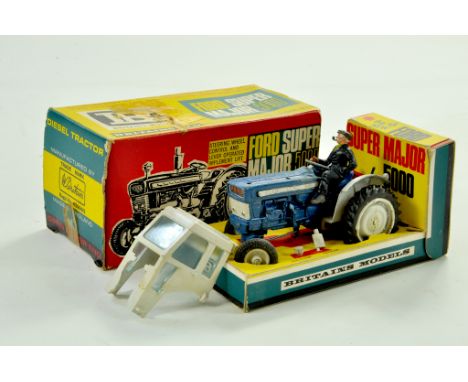 Britains 1/32 Farm issue comprising Ford 5000 Super Major Tractor. Example is complete in addition to Driver and Cab. Some ag