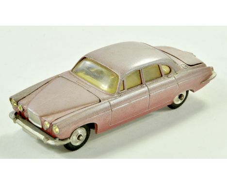 Corgi No. 238 Jaguar Mark X. Issue is metallic cerise with cream interior. Some obvious fading so fair to good.  Note: We are