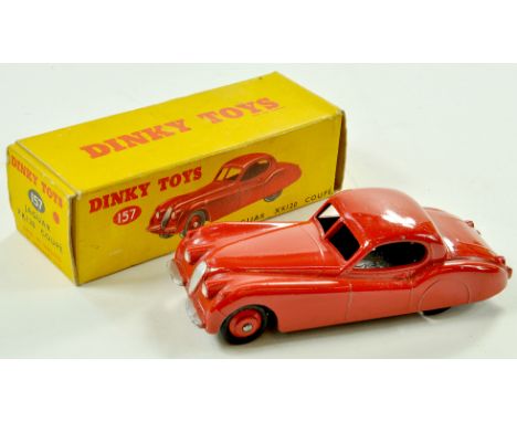 Dinky No. 157 Jaguar XK120 Coupe. Issue has red body and ridged hubs with black smooth tyres and silver trim. Appears very go