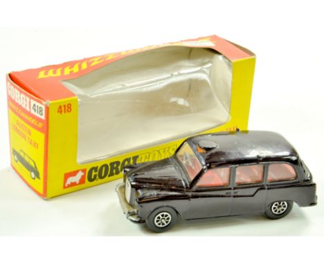 Corgi No. 418 Whizzwheels Austin London Taxi. Good in fair to good box. Note: We are always happy to provide additional image