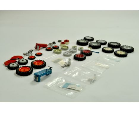 A large quantity of mostly Scaledown bespoke Model Tractor Parts relating to different makes. Wheels, Bonnets, Decals and mor