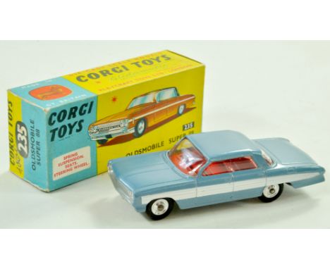 Corgi No. 235 Oldsmobile Super 88. Issue is light metallic blue with white side flashes, silver trim, red interior and spun h