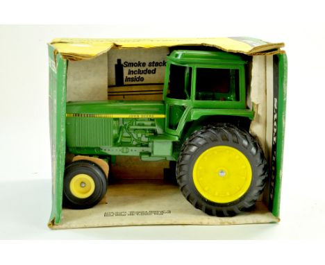 Ertl 1/16 farm issue comprising John Deere Tractor. Appears excellent in box. Note: We are always happy to provide additional