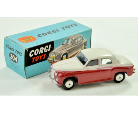 Corgi No. 204 Rover 90 Saloon. Issue is two-tone pale grey and metallic cerise with silver trim and flat spun hubs. A lovely 