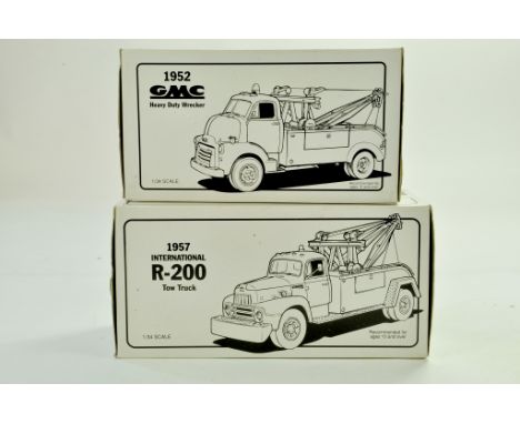First Gear Duo of 1/34 diecast trucks. GMC Wreck Truck plus International Tow Truck. Both never removed from boxes hence exce
