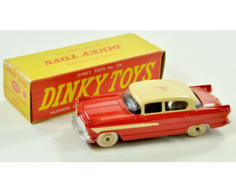 Dinky No. 174 Hudson Hornet Sedan. Issue is two-tone red and cream. Appears very good, note rub mark on roof, elsewhere, the 