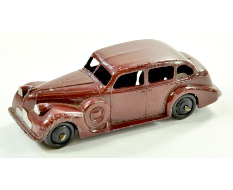 Dinky No. 39d Buick. Issue has maroon body, black ridged hubs. Appears generally good, some notable age related wear. Note: W
