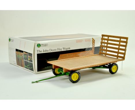 Ertl 1/16 Farm Issue comprising John Deere Hay Wagon. Precision Series. Appears excellent with box.  &nbsp;Note: We are alway