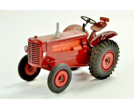 CIJ tinplate battery operated Tractor in red with orange plastic engine. Untested but appears a well preserved example.  Note
