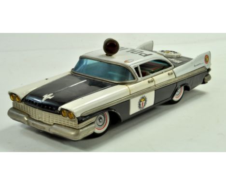 Large Tinplate Battery Operated Plymouth Police Car. Showing some signs of wear but still a good to very good example. Note: 