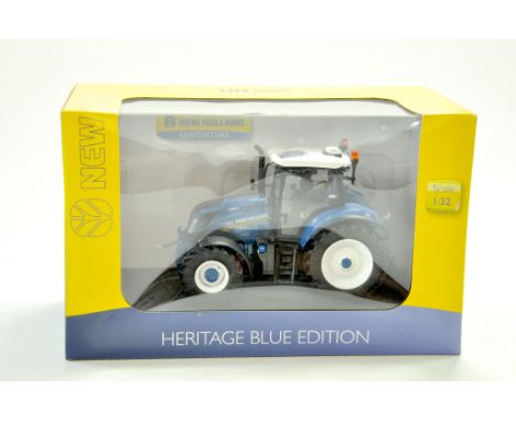 Universal Hobbies 1/32 Farm issue comprising New Holland T6.180 Heritage Blue Tractor. Excellent and secured in box. Note: We
