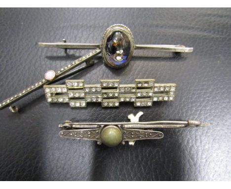 A collection of 5 bar brooches 3 are marked silver, pink opal bar brooch has inscription on the back '11th Nov 1918' marking 
