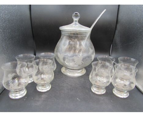 An etched punch bowl with 8 glasses and ladle