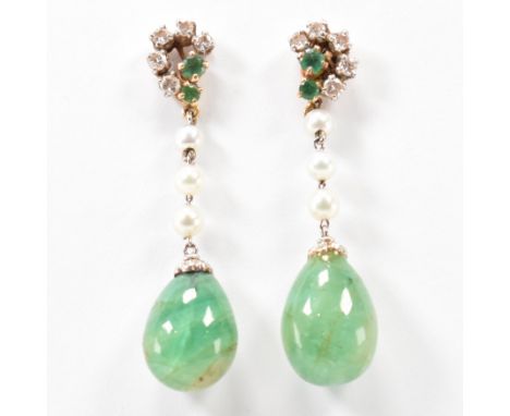 A pair of 18ct gold emerald, pearl and diamond day and night pendant drop earrings. The earrings having a large emerald pear 