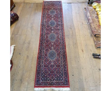 A Persian Tabriz runner, 354 x 79 cm 