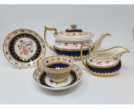 A 19th century part tea service, comprising a tea pot, cream jug, a cup, four saucers, a Royal Worcester bush ivory plate, an