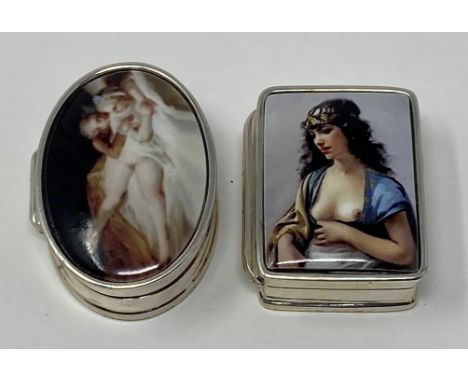 A silver and enamel pillbox, decorated a nude, and another (2)This is a modern copy 