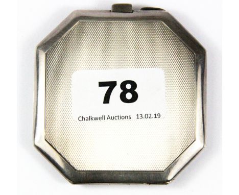 A hallmarked silver compact with engine turned decoration, 7 x 7 x 0.8cm.