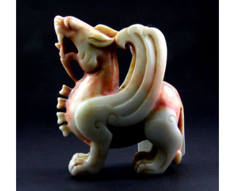 An impressive 19th/ early 20th Century Chinese carved mixed colour jade/ hardstone figure of a winged dragon, H. 10cm.