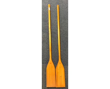 Two vintage canoe paddels.