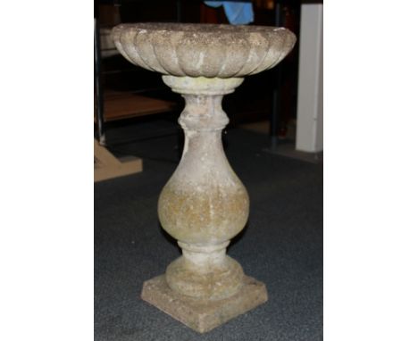 A vintage concrete garden bird bath, H. 60cm.