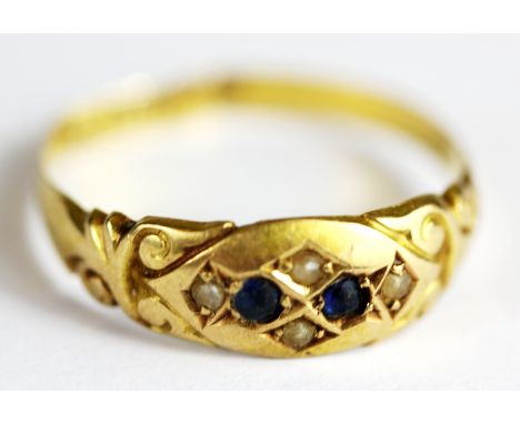 An 18ct yellow gold sapphire and pearl set ring, (slightly a/f).