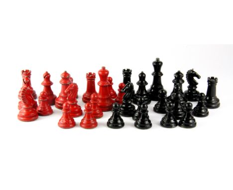 A vintage cast metal chess set, king H. 5cms.
