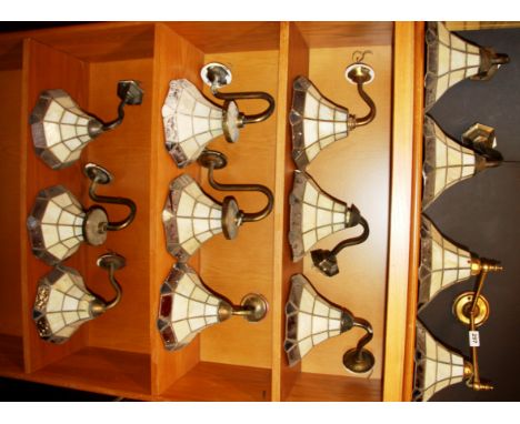A group of eleven stained glass wall lights and one double wall light, shade Dia. 20cm.