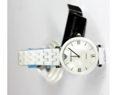 A boxed lady's Emporio Armani wrist watch with a mother of pearl dial, unused.