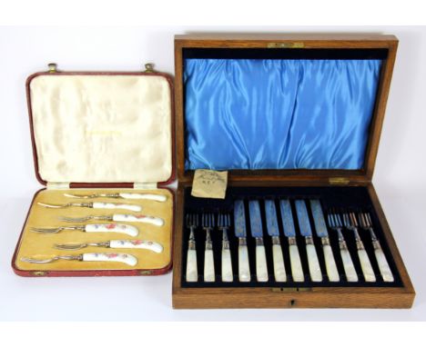 A cased set of mother of pearl handled fruit knives and forks and a cased set of Royal Crown Derby fruit forks