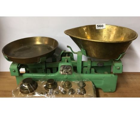 A vintage brass scale and weights, L. 45cm.