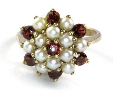 A 9ct yellow gold garnet and pearl set large cluster ring, (Q).