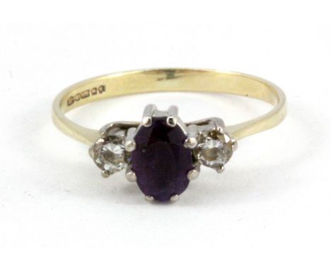 A 9ct yellow gold amethyst and white stone set ring, (K).