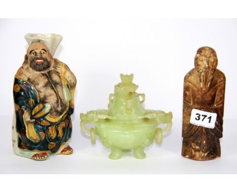 An unusual mid 20th Century Chinese porcelain figural rice spirit bottle, H. 17cm, together with a carved stone figure and a 