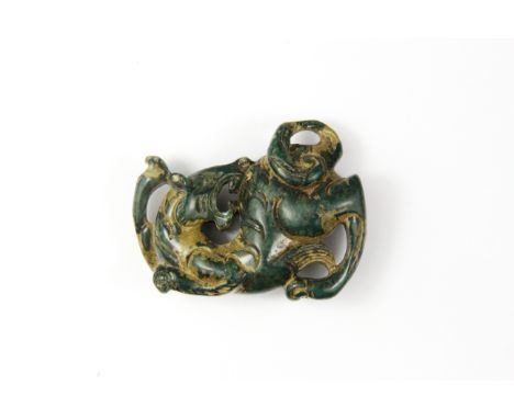 A Chinese archaic form carved jade figure of a dragon, W. 6cm.