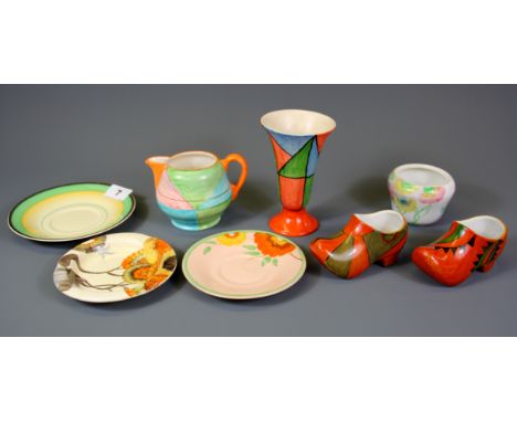 A group of Clarice Cliff and Wilkinson ceramic items.