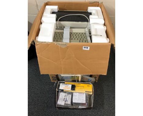 A vintage Amstrad PCW 8256 computer with system disks, manuals, printer etc.