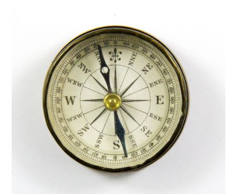 A vintage brass pocket compass, Dia. 3.5cm.