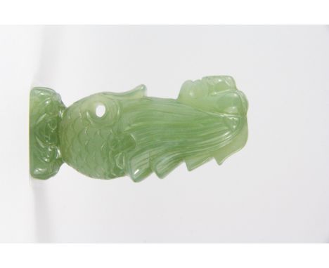 A finely carved Chinese celadon green jade /hardstone figure of a fish with a dragon's head, H. 7.5cm.