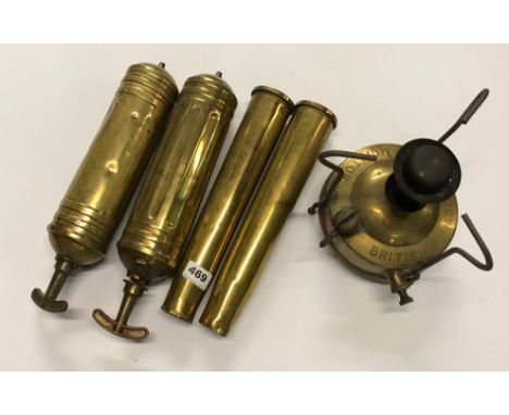 Two vintage brass fire extinguishers, two World War Two brass shells and  brass gas stove.