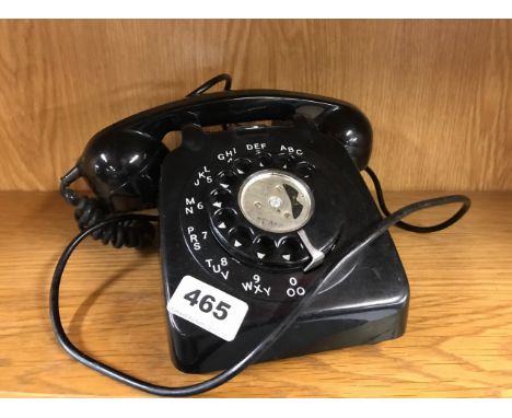 A vintage black telephone.